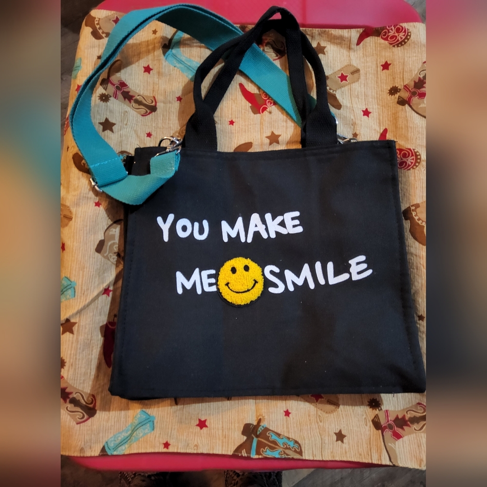 Hugs For Heros Black Tote with Teal Straps and Smile Design